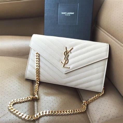 white ysl bag gold chain.